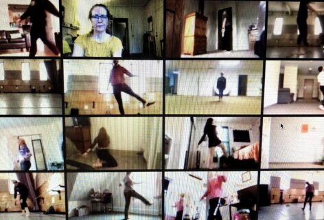 Sixteen squares are seen on a video Zoom screen with people in each of them, in various places inside the square. The people inside are dancing. Julie Mayo is looking on/into the Zoom class, so her face is closer up to the screen. Photo Courtesy of the artist.