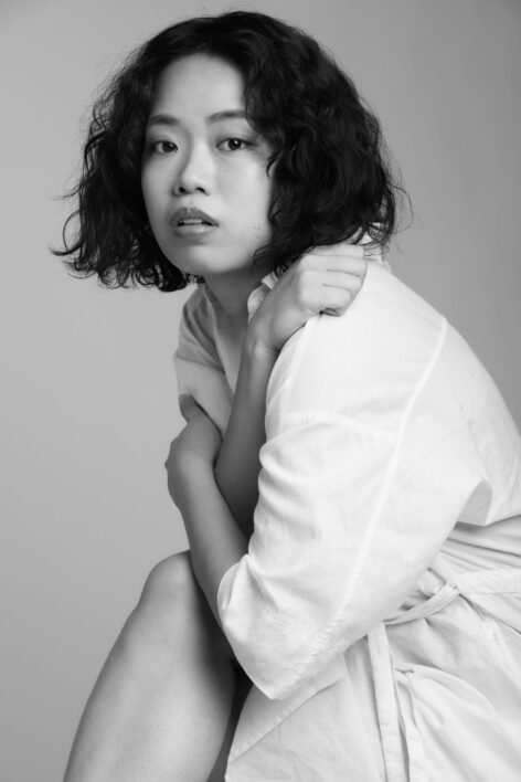 Headshot of Natsumi Sasabe. She looks into the camera with her arms over her chest. Her hair is cut in a bob. Photo by Ryo Chin