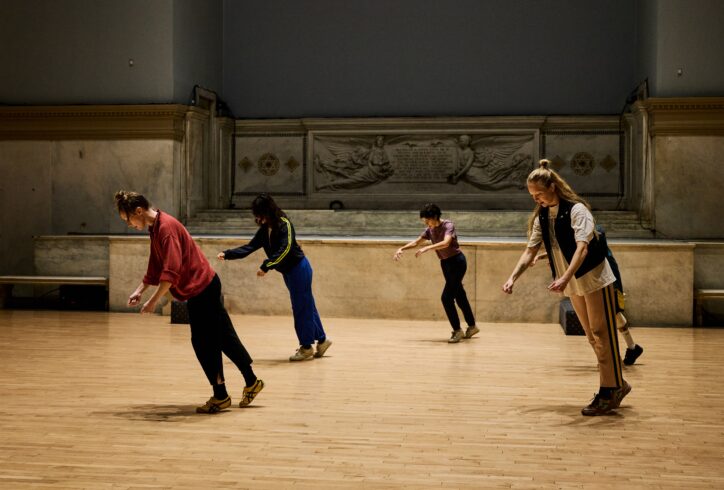 James Barrett's piece for Movement Research at the Judson Church. Five dancers lean forward suspended in time. Photo by Ryutaro Mishima.