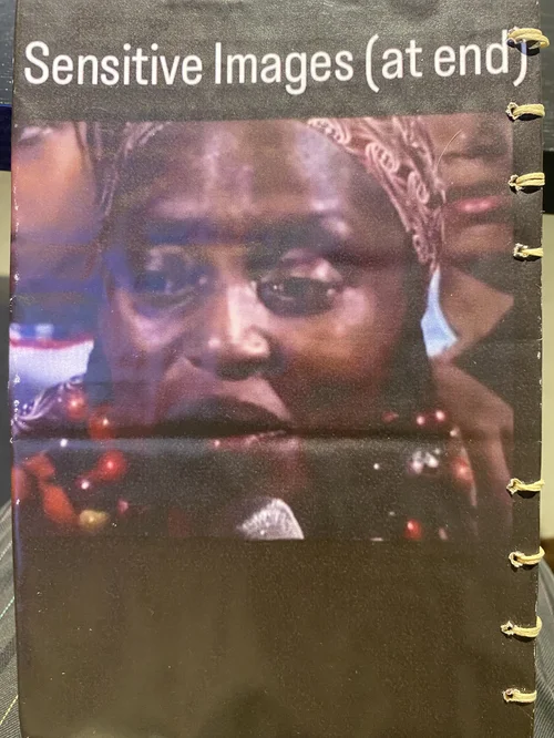 Photo of cover for Jordan Deal’s 320 pg handmade book of appropriated images found on the internet titled black conscious it to erupt (2024). The cover text reads “Sensitive Images (at the end)” layered over unknown image.